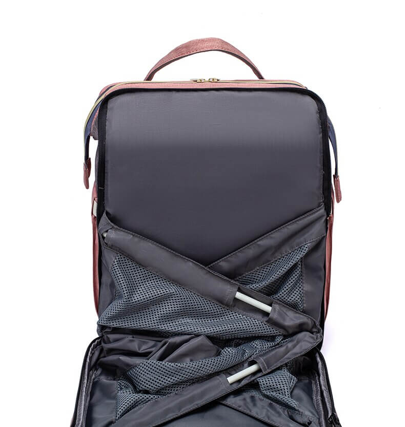 Practical multi-function travel backpack for women, converts to a portable baby changing bed.