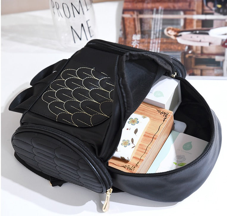Fashionable women's multi-pocket PU leather backpack, adorned with a charming owl print. Casual & versatile.