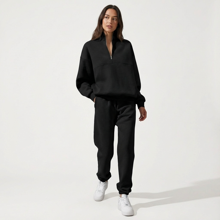 Women's navy blue cozy half-zip loungewear set with joggers, perfect for comfortable casual wear and travel.