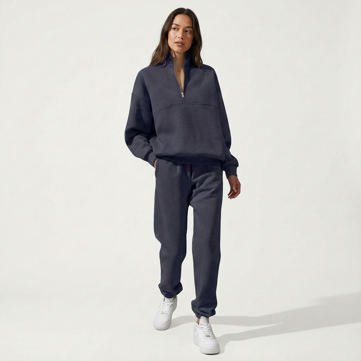 Beige women's matching loungewear set, featuring a cozy half-zip top and comfortable jogger pants for effortless style.