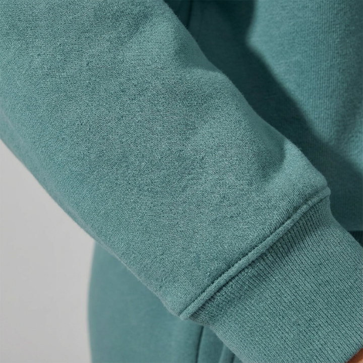 Front view of a black women's cozy half-zip loungewear set, combining comfort and effortless style.