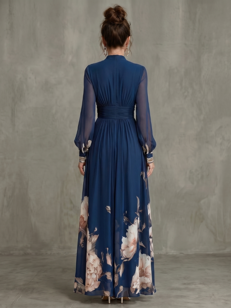 Full-length women's formal pleated maxi dress in navy, showcasing sheer long sleeves & a graceful silhouette.