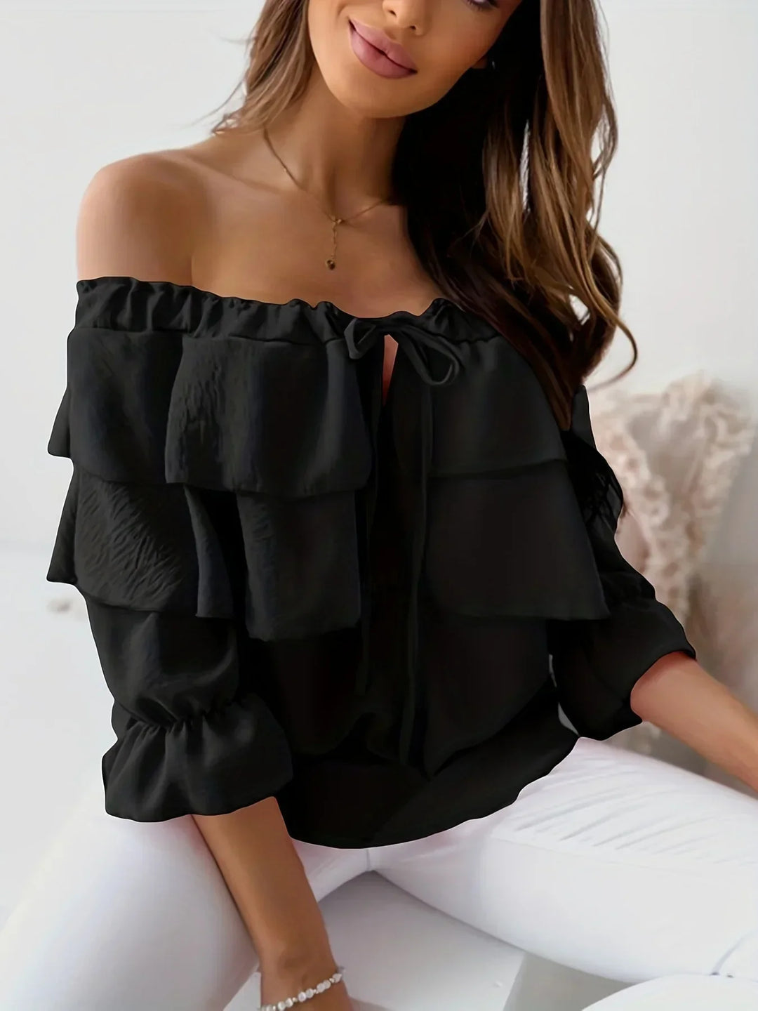 Comfortable women's off-shoulder blouse. Feminine tiered ruffles & tie-front design. Long sleeves for elegant style.