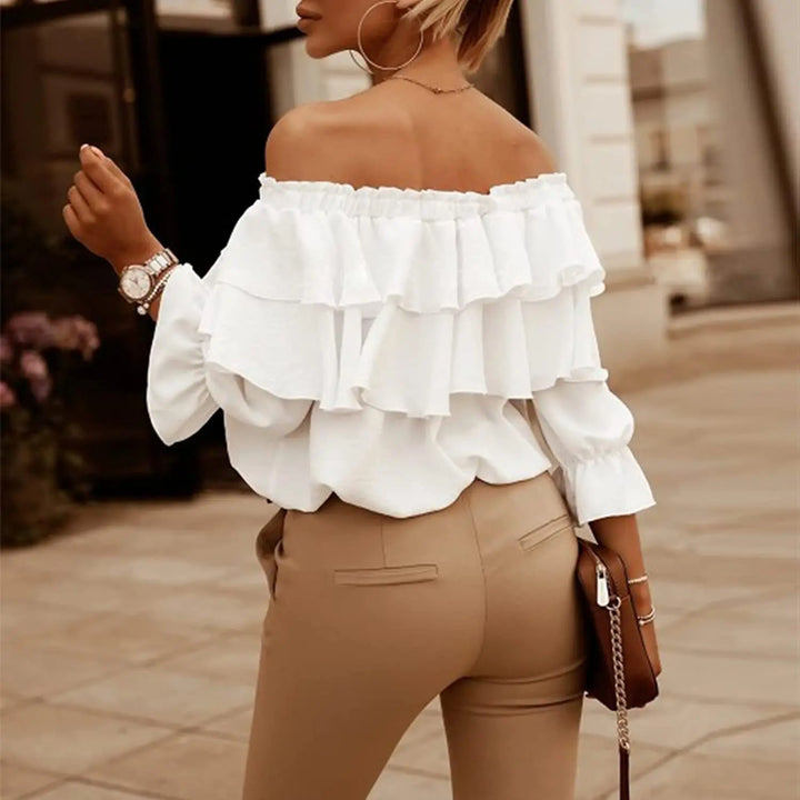Stylish women's off-shoulder long sleeve blouse. Features tiered ruffles & a tie-front, perfect for elegant smart casual looks.