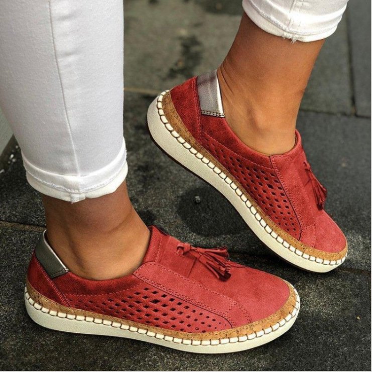 Stylish women's slip-on comfort slippers, providing orthopaedic arch support for daily casual wear.