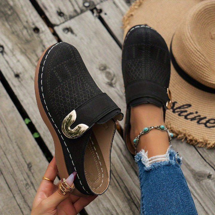 Women's orthopedic arch support slippers with non-slip sole for ultimate comfort and stability.