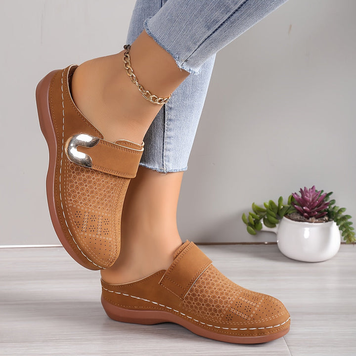 Cozy women's house shoes offering orthopedic arch support and foot relief with non-slip grip.