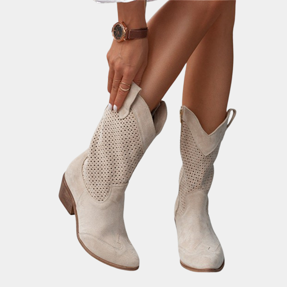 Orthopedic women's cowboy boots with arch support. Stylish perforated western footwear.