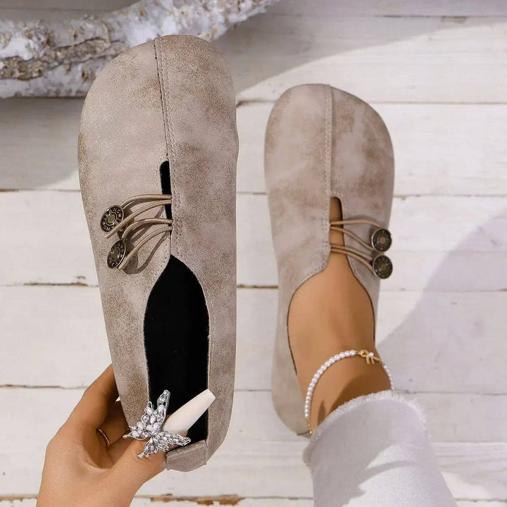 Brown women's supportive orthopedic shoes with arch support, offering cushioned comfort & versatility.