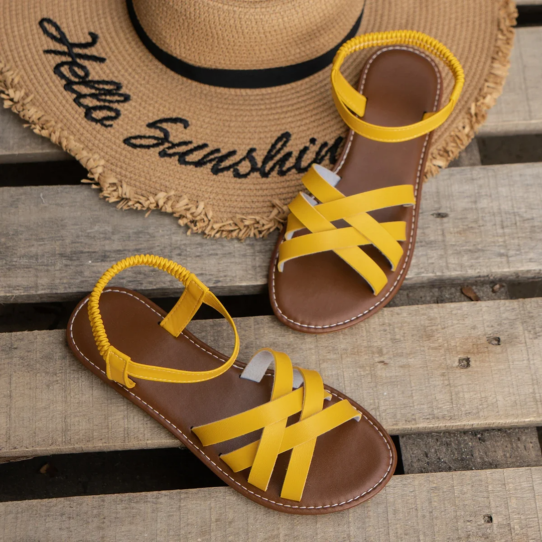 Women's orthopedic spring sandals, featuring arch support, adjustable straps, designed for comfort & relief.