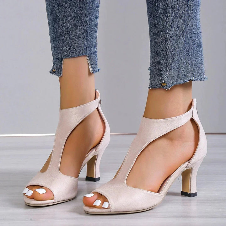 Comfortable women's orthopedic mid-heel T-strap shoes. Supportive open-toe design for summer fashion.