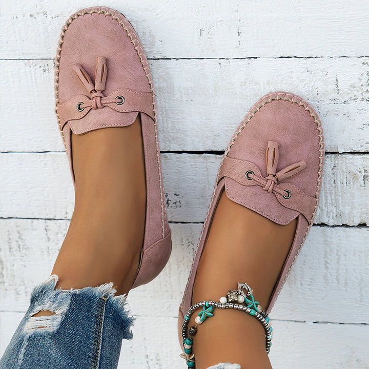 Women's orthopedic loafers with premium arch support, elegant tassel design & slip-on convenience.