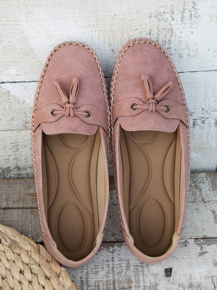 Fashionable women's orthopedic tassel loafers, blending elegant style with supportive comfort shoes.
