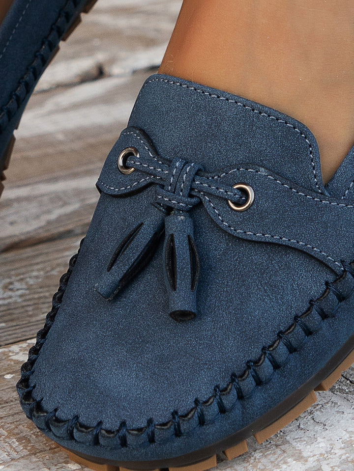 Top view of elegant women's orthopedic tassel loafers, classic slip-on comfort shoes for women.