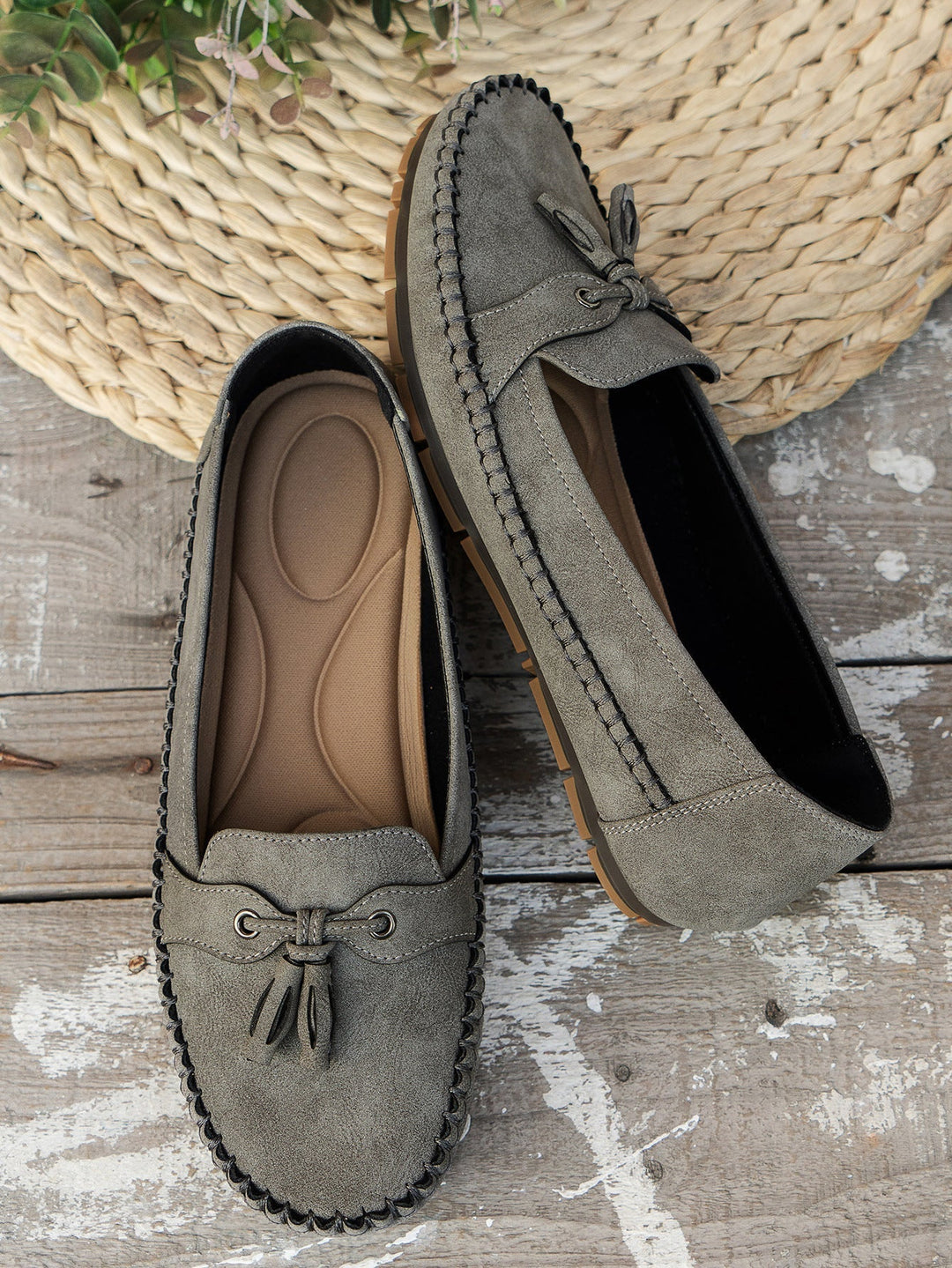 Detail of tassel on women's orthopedic loafers, highlighting craftsmanship & elegant casual style.