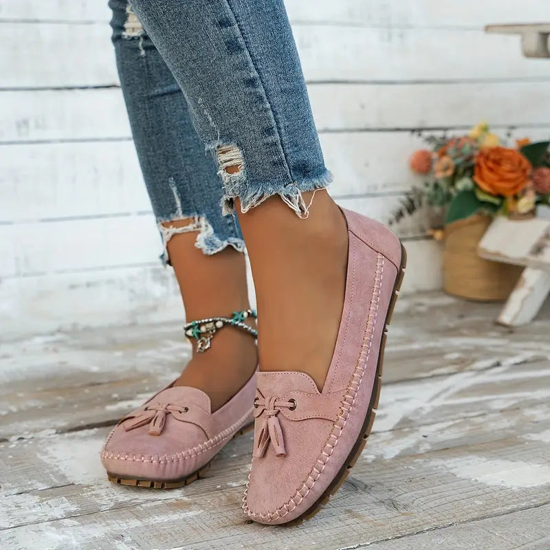 Supportive women's tassel loafers with orthopedic arch support, comfortable slip-on daily footwear.
