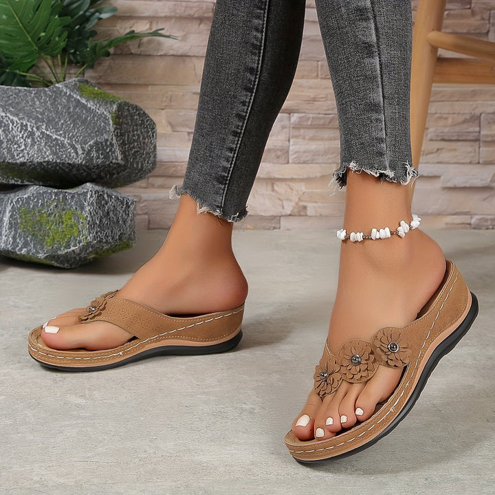Supportive women's orthopedic wedge sandals with arch support for comfortable summer wear.