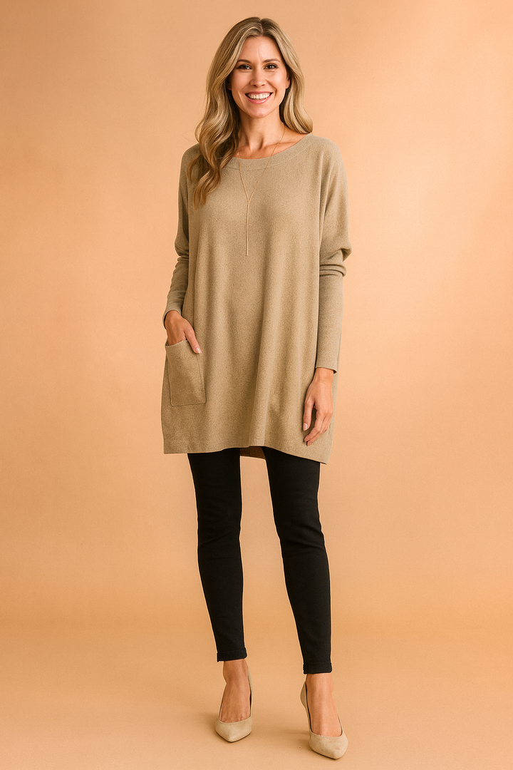 Cozy women's oversized knit sweater with pockets. Soft long-sleeve pullover for relaxed everyday fashion.