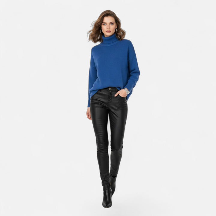 Stylish women's thick knit oversized turtleneck sweater, a comfortable fall & winter staple.