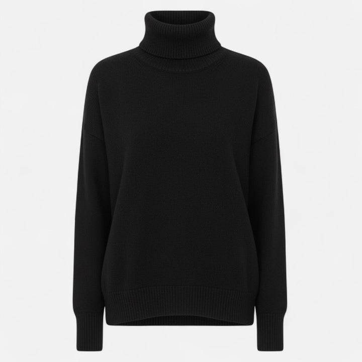 Cozy women's oversized thick knit turtleneck sweater, essential for comfortable winter warmth.