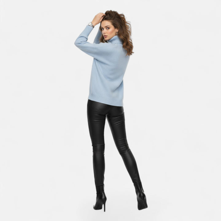 Elegant women's oversized thick knit turtleneck, a relaxed fit sweater for chic winter days.