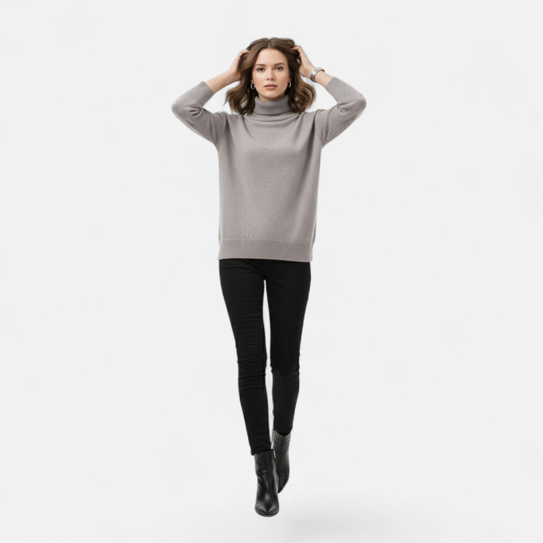 Warm women's thick knit oversized turtleneck sweater, ideal for cozy winter fashion.