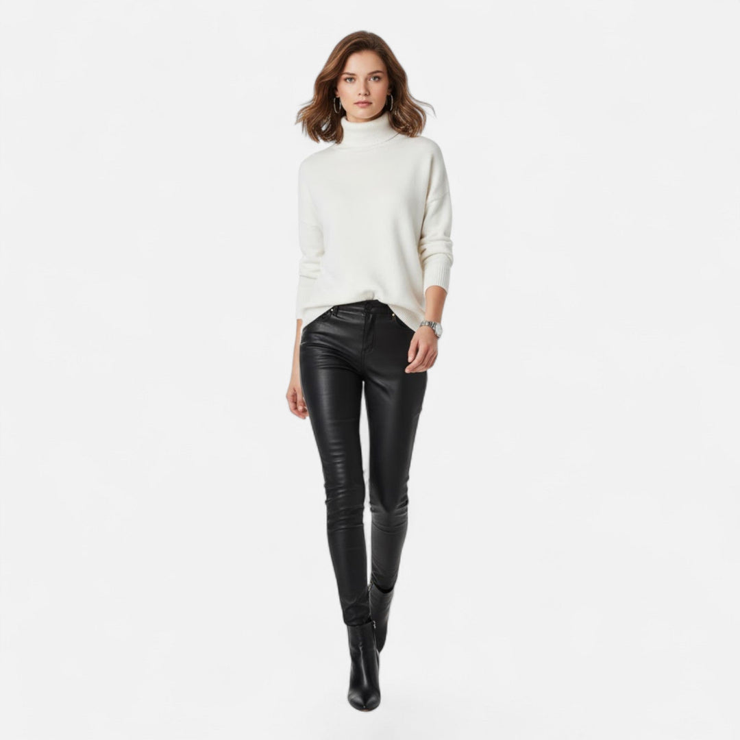 Cozy women's oversized thick knit turtleneck sweater in a stylish winter fashion design.