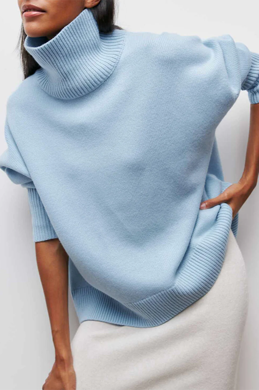 Women's oversized turtleneck pullover sweater in a relaxed fit, perfect for cozy winter fashion and fall style.