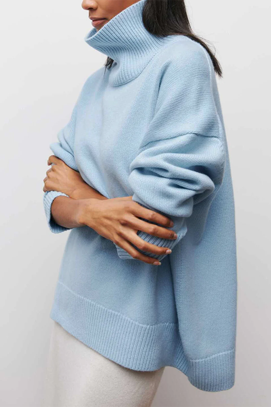 Cozy women's oversized turtleneck sweater with a drop shoulder design, ideal for comfortable casual wear.