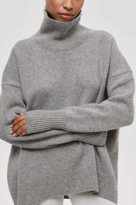 Soft knit oversized turtleneck sweater, highlighting its comfortable, cozy texture for women's winter fashion.