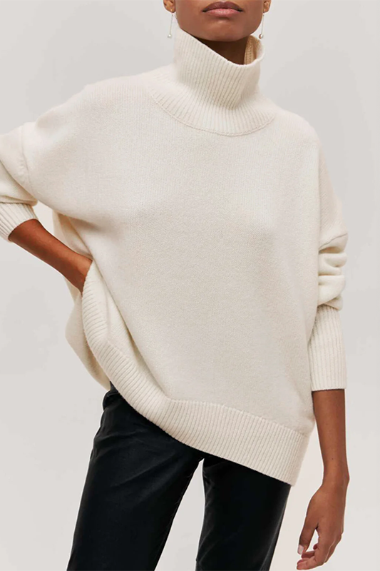 Warm and cozy women's oversized turtleneck sweater, a comfortable pullover for chilly fall and winter days.
