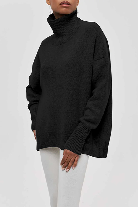 Versatile oversized women's turtleneck sweater with a relaxed drop shoulder, great for everyday cozy comfort.