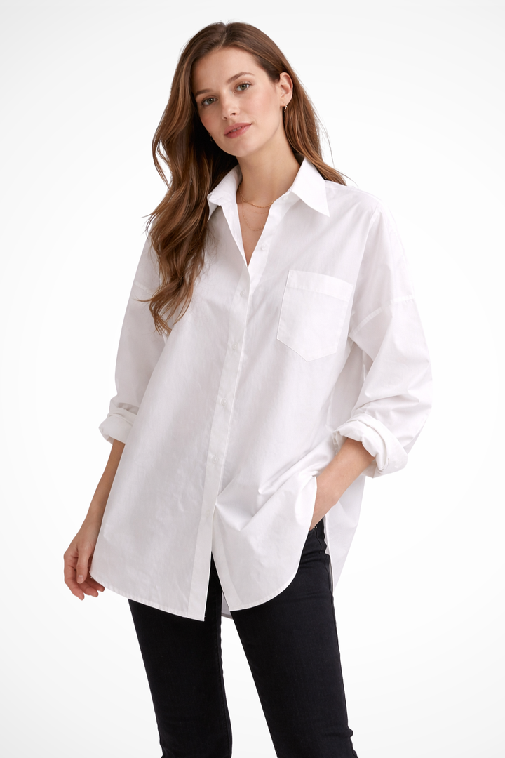 Women's oversized white button-down long sleeve blouse. Relaxed fit casual shirt for modern style & versatile fashion.