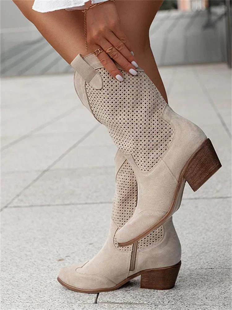 Women's perforated Western ankle boots with a stylish block heel for versatile fashion.