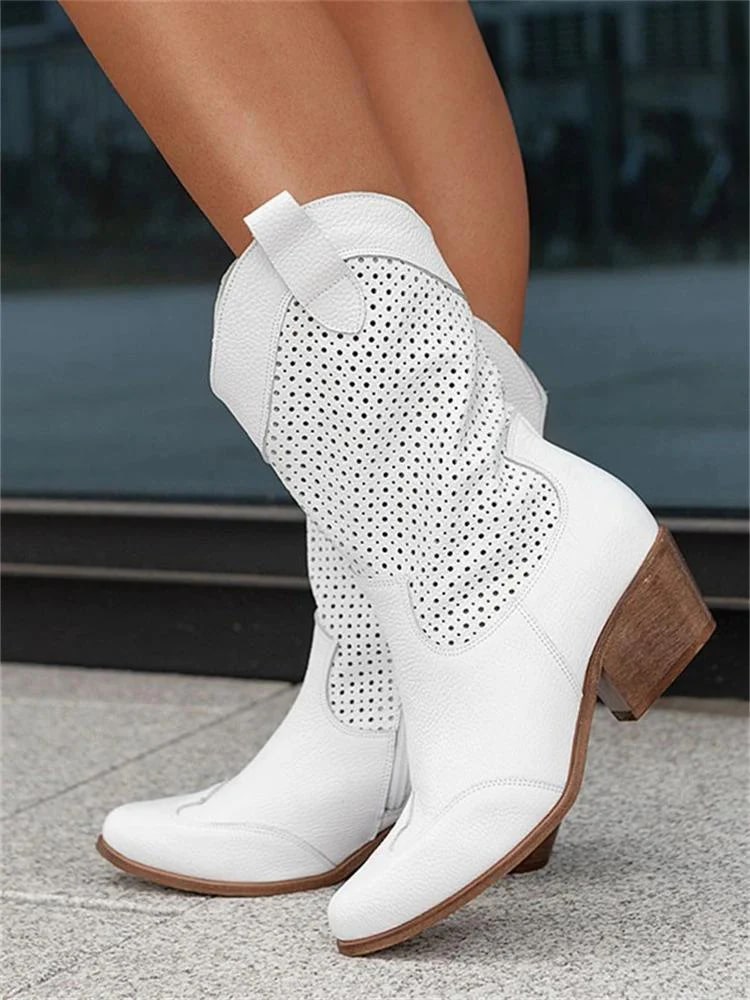 Women's perforated Western ankle boots. Stylish, comfortable, and versatile block heel footwear.