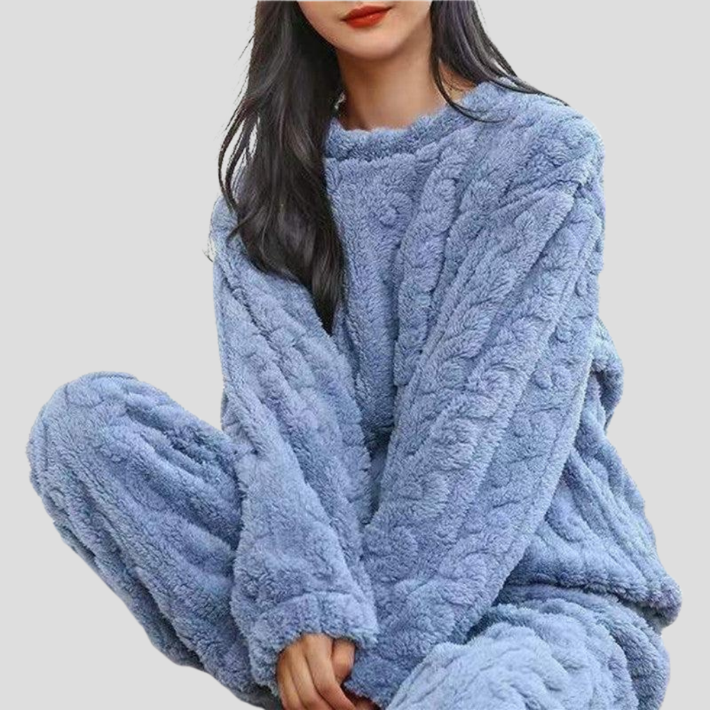 Women's plush fleece pajama set for cozy, warm comfort. Ideal for winter sleepwear & loungewear.