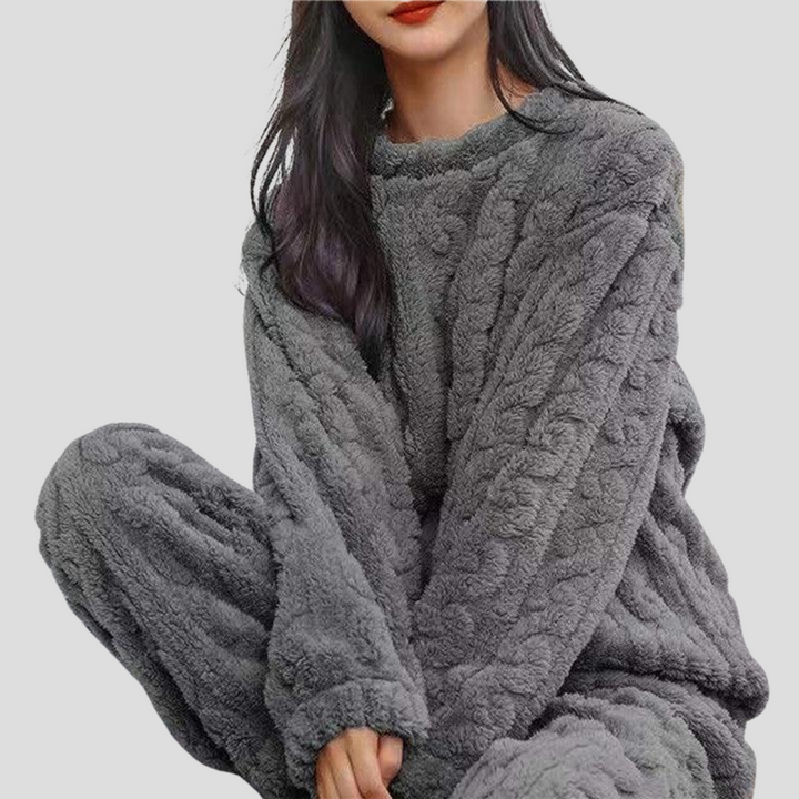 Soft, comfortable women's fleece pajama set for ultimate warmth and relaxation during cold winter nights.