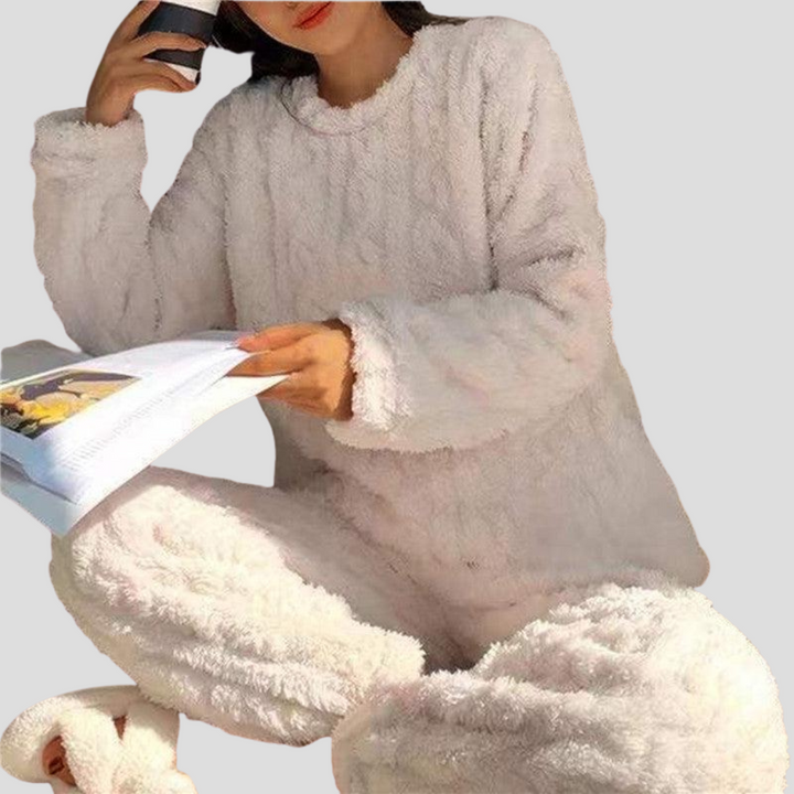 Cozy women's fleece pajama set, perfect for warm home wear and relaxed lounging. Soft winter sleepwear.