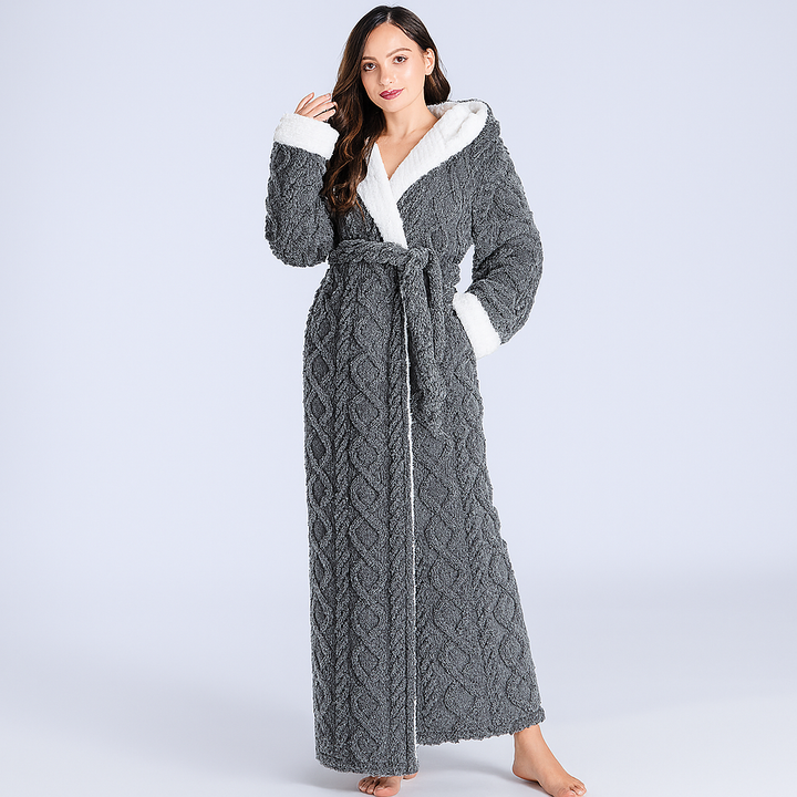 Cozy pink women's long hooded flannel bathrobe for plush sleepwear. Experience ultimate warmth and comfort.
