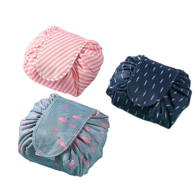 Women's portable drawstring cosmetic bag in grey flamingo print, ideal travel toiletry organizer.