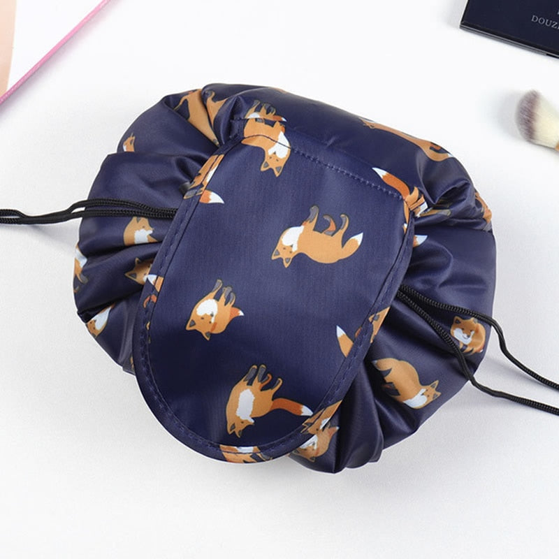 Close-up of the grey flamingo pattern on a portable drawstring cosmetic bag, women's travel organizer.