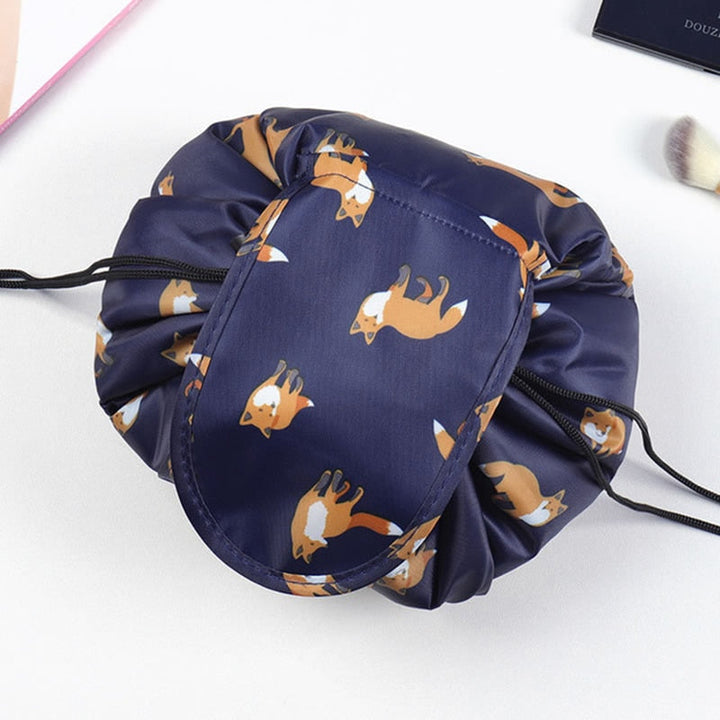 Close-up of the grey flamingo pattern on a portable drawstring cosmetic bag, women's travel organizer.