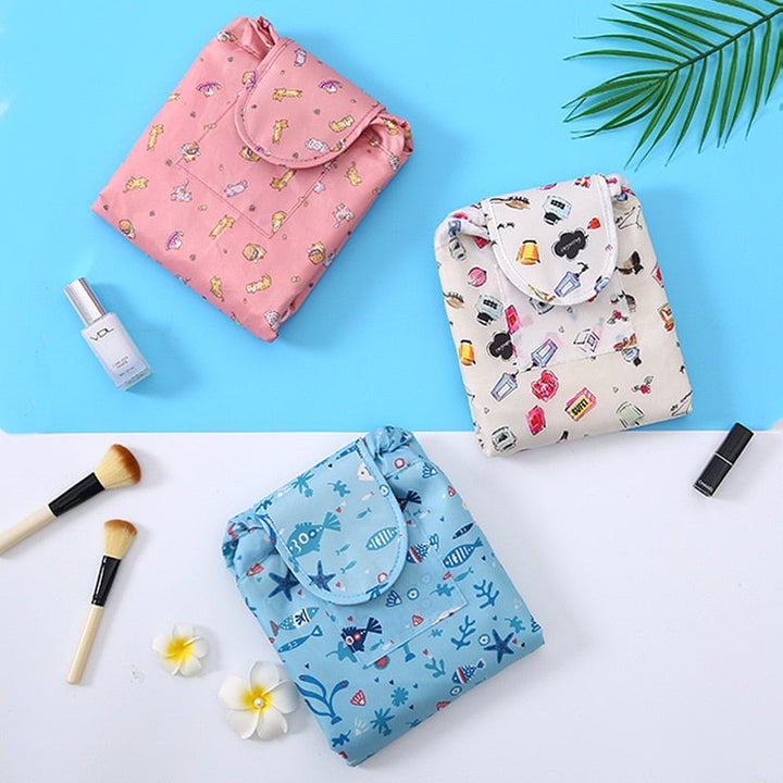 Grey flamingo portable drawstring cosmetic bag, a stylish & compact travel organizer for beauty essentials.