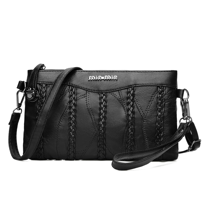 Women's PU leather crossbody clutch. Stylish and practical shoulder bag with a spacious interior.