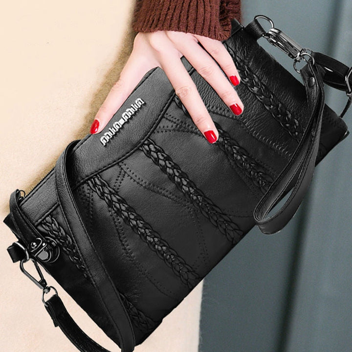 Versatile women's PU leather day-to-evening crossbody clutch. Fashionable and spacious shoulder purse.