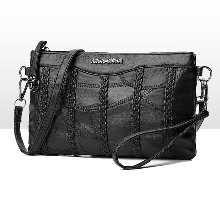 Modern PU leather women's crossbody clutch. Chic shoulder bag with a roomy interior, perfect for any outfit.