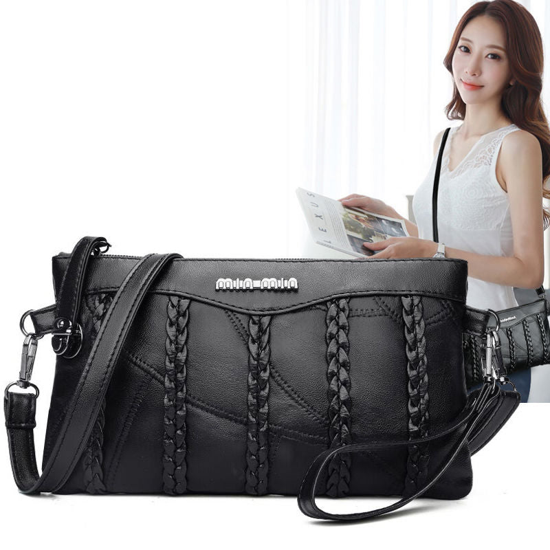 Stylish women's PU leather crossbody clutch. Designed as a fashionable shoulder bag with a spacious interior.