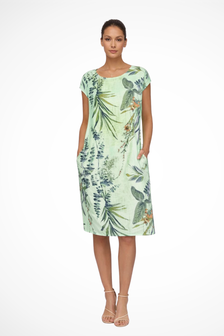 Vibrant botanical print women's relaxed fit summer dress. Sleeveless, easy-wear, ideal for sunny days.