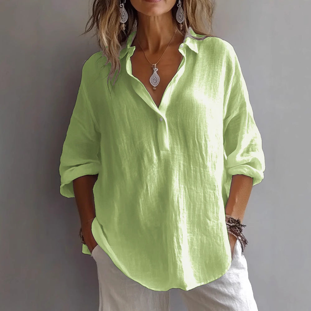 Lightweight women's relaxed fit button-up shirt with trendy wide sleeves. Ideal for spring and summer comfort.