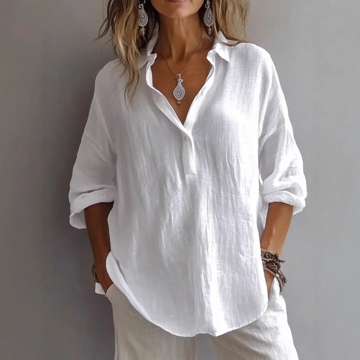 Effortlessly chic women's relaxed fit button-up shirt featuring stylish wide sleeves. Great for spring fashion.